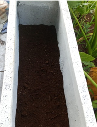 Pekerjaan lanskap pot barier - Pengisian tanah